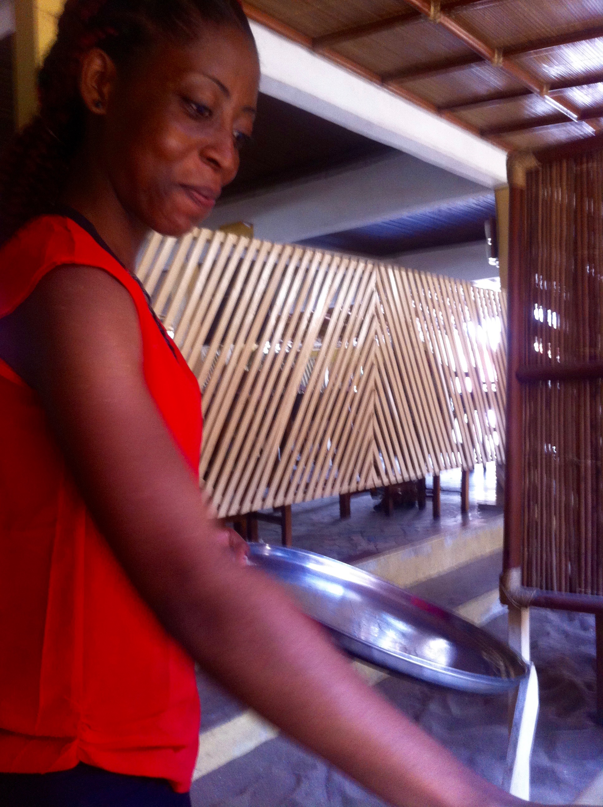 Serving buka food in Cotonou, Benin.